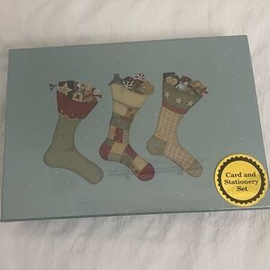 vintage Christmas boxed card and stationery set. 
It includes 16 cards